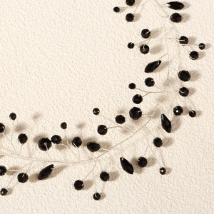 Detail of handcrafted bridal hair vine with black faceted crystals and silver wire