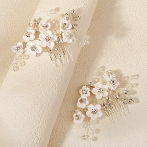 Elegant bridal hair combs with white clay flowers, crystals, and pearls on silver base
