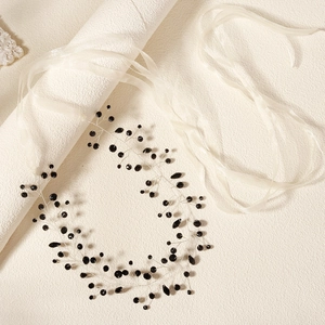 Handmade black crystal bridal belt with beaded detailing and elegant white ribbon ties