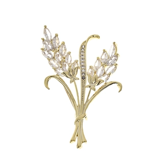 Elegant gold wheat ear brooch with sparkling zircon stones in a harvest style design