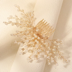 Elegant handmade bridal hair comb with white pearls and gold branches for wedding hairstyles
