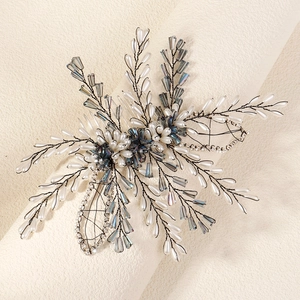 Detail of handmade bridal hair comb with pearls, blue crystals and rhinestone beadwork