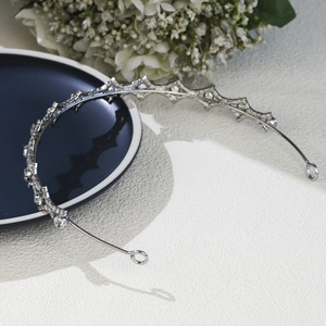 Macro shot of silver rhinestone bridal tiara with sparkling crystal geometric details