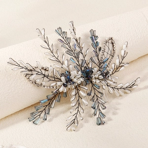 Handmade bridal hair comb featuring pearls and blue crystals for weddings and parties