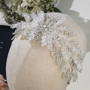 Luxurious bridal headband with crystal leaf motifs and silver rhinestones for weddings