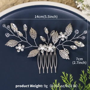 Detail view of handmade bridal hair comb with pearls and leaves measuring 14x7cm