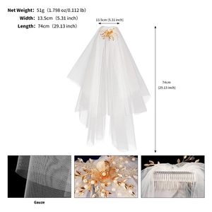 White wedding veil with gold floral hair comb featuring pearls and crystal accents