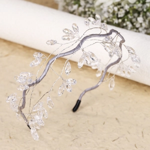 Detail of grey satin bridal headband with silver wire and transparent leaf crystals
