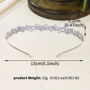Detail shot of a silver wave tiara with marquise zircons and exact measurements
