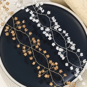 Handmade bridal vine headband with metallic flower petals for wedding hair styling