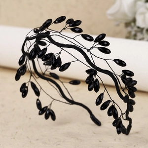 Detail view of handmade black crystal bead headband with woven forest style branches