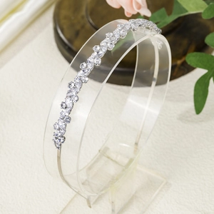 Detail view of silver floral zircon headband with marquise crystals on acrylic stand