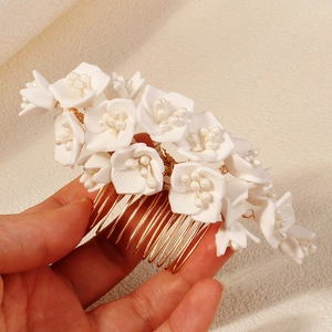 Handmade white floral hair comb with pearls and gold metal teeth for wedding hairstyles