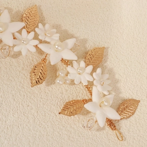 Exquisite bridal headband with handmade white clay flowers and golden leaf details