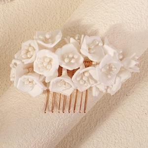 Handmade white floral hair comb with faux pearls and golden teeth for wedding hairstyles