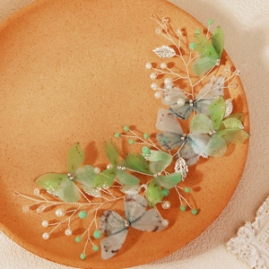 Exquisite bridal butterfly hair clip with green tulle wings and delicate pearls