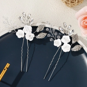 Handmade bridal hair pins with ceramic flowers and rhinestones on silver wire