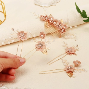 Five-piece bridal hair jewelry set featuring pink fabric flowers and golden accents