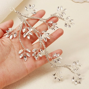 Detailed view of hand-held bridal hair vine with marquise rhinestones and silver wire