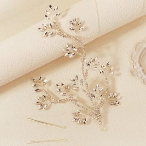 Detail of silver bridal hair vine with sparkling marquise rhinestones and matching bobby pins