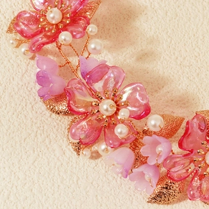 Elegant floral headband with pink acrylic petals, pearls and gold metal leaves