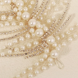 Elegant bridal hairband with handmade pearls and silver crystals in leaf design