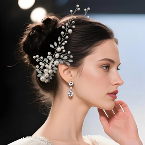 Detailed view of bride hair accessory with pearls and crystals on silver wire