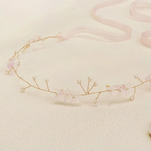 Elegant bridal floral headband with pink silk flowers and pearls on gold branches
