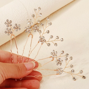 Five-piece bridal hair pins set with rhinestones and golden wire flower branch design