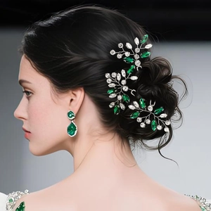 Detail of emerald green crystal hair pins with silver wire wrapping on bridal hairstyle