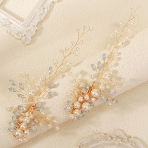 Handmade gold floral bridal hairpins with white pearls and light blue crystals