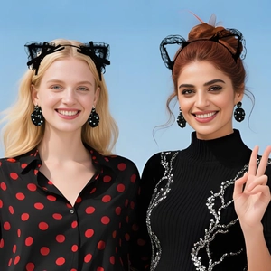 Close-up of black lace cat ear headband and large sparkling polka dot earrings set