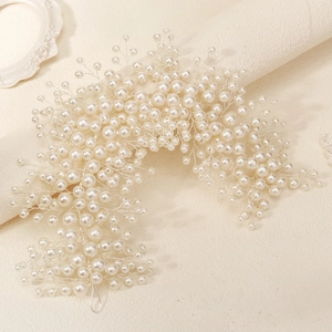 Elegant bridal headband crafted with handmade pearls and silver wires for wedding styling