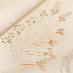 Sparkling rhinestone flower bridal hair pins set in silver and rose gold for weddings
