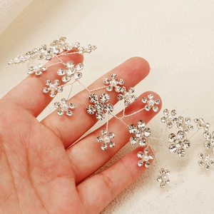 Detail of silver bridal hair vine with sparkling rhinestones and delicate pearls