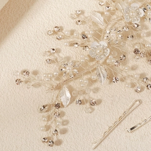 Elegant bridal hair vine and pins set with white flowers and pearls on silver wire