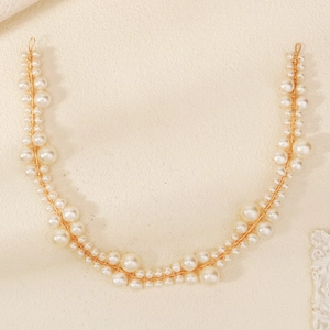 Elegant gold wire bridal headband with white pearls for minimalist wedding hairstyles