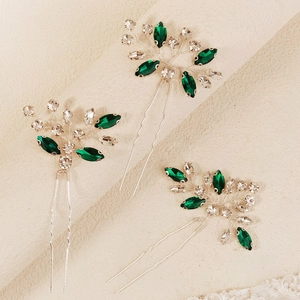 Three-piece bridal hair pin set with green marquise rhinestones and silver wire leaves
