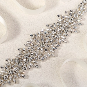 Detailed close-up of sparkling marquise crystal leaves on a bridal wedding belt accessory