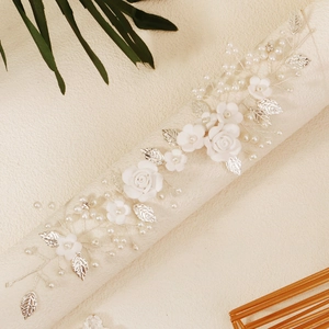 Elegant bridal hair vine with white ceramic roses, faux pearls and silver metal leaves