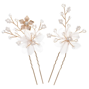 Handmade bridal hair pins with tulle flowers, pearls, and gold leaf accents for weddings