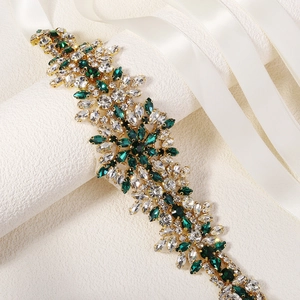 Luxurious bridal sash with emerald and clear rhinestones on elegant white satin ribbon