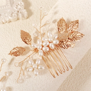 Golden bridal hair comb set with metallic leaves and white pearls for wedding updos