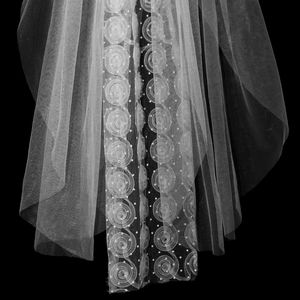 Elegant white bridal veil featuring 3D rose patterns and dots on mesh fabric