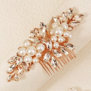 Elegant rose gold bridal hair comb with white pearls and sparkling leaf-shaped crystals