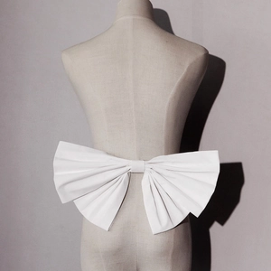 Elegant white bridal bow accessory with pleated design for wedding dress and gowns