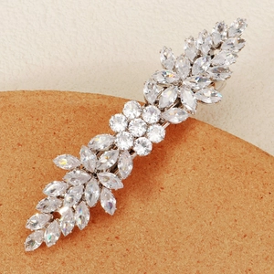 Close-up of silver hair clip with zircon floral patterns and marquise cut crystals