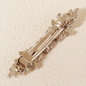 Sparkling silver crystal hair clip with leaf-shaped zircon decoration from a back angle
