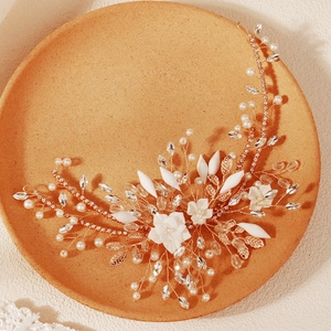 Handmade golden bridal headband with white ceramic flowers, crystals and pearls