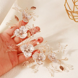 Handmade bridal hair vine with golden wires, white petals, crystal butterflies and pearls